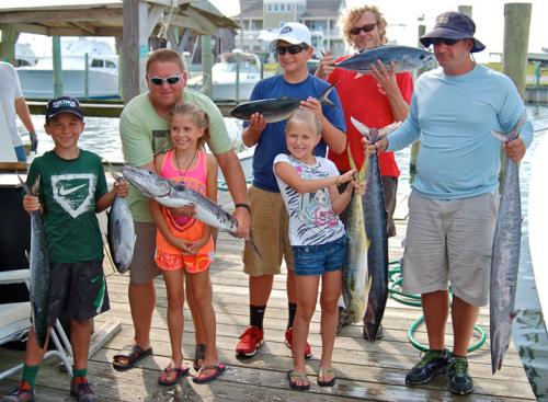“Let’s help show off this king mackerel, blackfin, barracuda, bluerunner, dolphin, wahoo and oceanic bonito catch.”   What a variety!